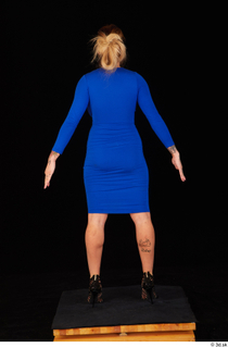 Daisy Lee black high heels blue dress casual dressed standing…